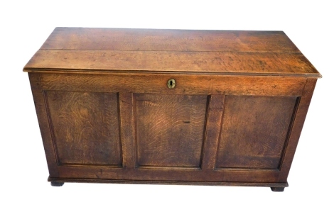 An oak three panel blanket box, with plain front, 70cm, 125cm wide, 51cm deep.