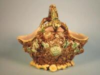 A 19thC Majolica basket with a stylised twig handle