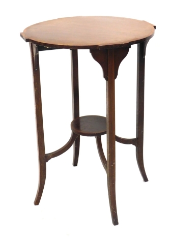 An Edwardian mahogany and boxwood strung occasional table, on square sabre legs joined by an under tier, 73cm high, 50cm wide, 50cm deep.