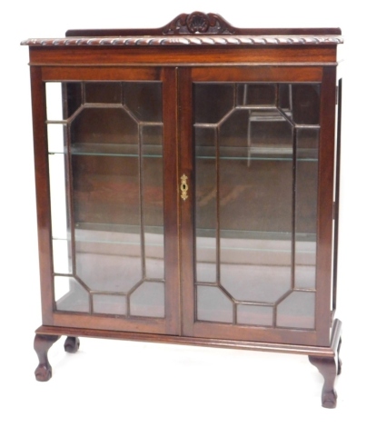 A mahogany display cabinet, with a raised back above two astragal glazed doors enclosing adjustable glass shelves, on cabriole legs, 91cm wide.