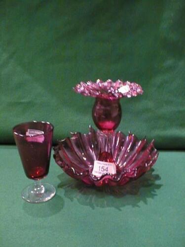 A Victorian cranberry crimped glass Candle Holder and cranbery tapered Glass