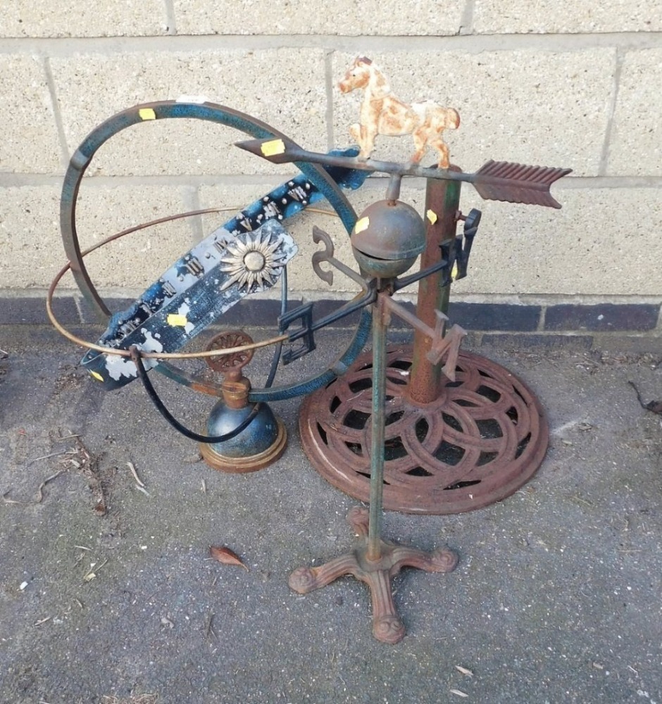 A cast metal armillary sundial, of orb form, 68cm high, a cast metal