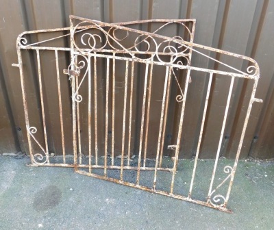 A white painted wrought metal garden gate, each section 94cm high, 95cm wide.