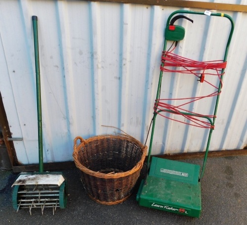 An electric scarifier, RE35, together with a lawn aerator, and wicker basket.