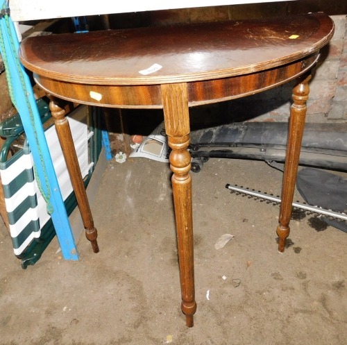 A 20thC D end table, raised on turned tapering legs, 76cm high, 75cm wide.