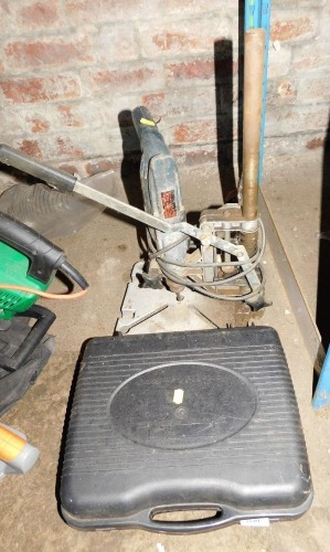 A Metabo electric drill on stand, and a portable camping stove. Buyer Note: WARNING! This lot contains untested or unsafe electrical items. It is supplied for scrap or reconditioning only. TRADE ONLY