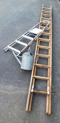 A wooden extending step ladder, together with a galvanized metal watering can and a metal A framed step ladder.