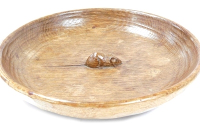 A Robert Mouseman Thompson of Kilburn oak circular bowl, with an adzed interior, carved with the signature mouse, 29cm wide.