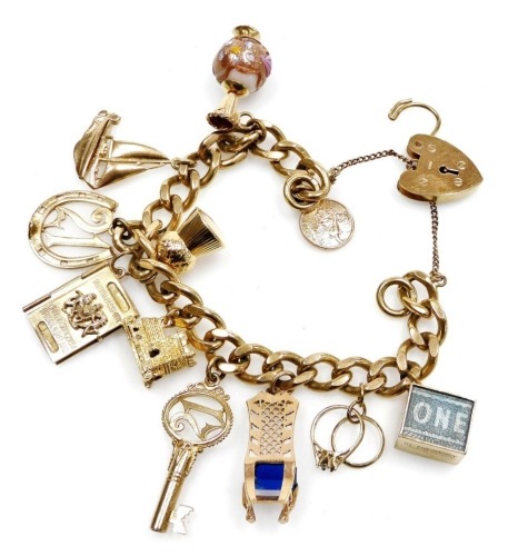 A 9ct gold curb link charm bracelet, with eleven charms as fitted, on a heart shaped padlock clasp, with safety chain, 59.2g all in.