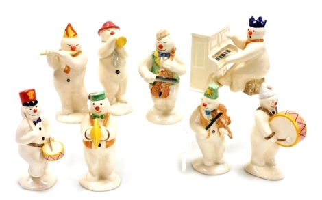 Eight Royal Doulton The Snowman gift collection figures, comprising Pianist Snowman, DS12, Drummer Snowman, DS15, Bass Drummer Snowman, DS9, Cymbal Player Snowman, DS14, Trumpeter Snowman, DS16, Violinist Snowman, DS11, Cellist Snowman, DS17, and Flautist