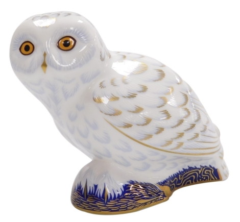 A Royal Crown Derby porcelain Snowy Owl paperweight, an exclusive for the Royal Crown Derby Collectors Guild, red printed marks and gold stopper, 10.5cm high, boxed.