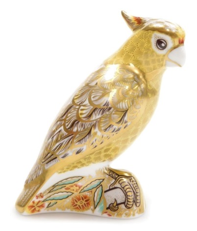 A Royal Crown Derby porcelain Citron Cockatoo paperweight, red printed marks and gold stopper, 14cm high, boxed.