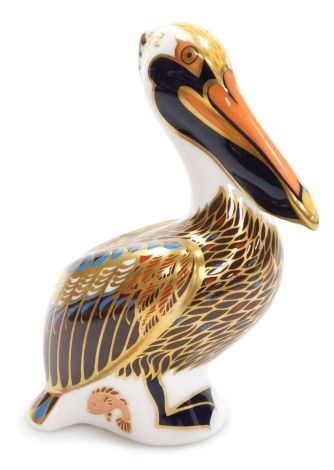 A Royal Crown Derby porcelain Brown Pelican paperweight, red printed marks and gold stopper, 14cm high, boxed.