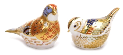 Two Royal Crown Derby porcelain paperweights, comprising Collectors Guide Fire Crest, red printed marks and gold stopper, 5cm high, and Linnet, designed by Tien Manh Dinh, red printed marks and gold stopper, 6.5cm high, both boxed.