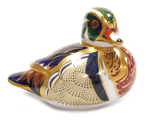 A Royal Crown Derby porcelain Carolina Duck paperweight, red printed marks and gold stopper, 8.5cm high, boxed.