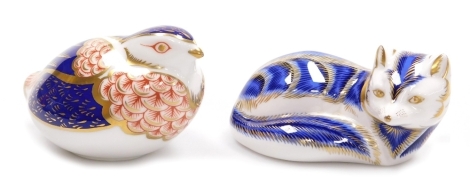 Two Royal Crown Derby porcelain paperweights, comprising Blue Fox, gold stopper, 11cm high, and a Quail, second, struck through red printed mark and silver stopper, 7cm high.