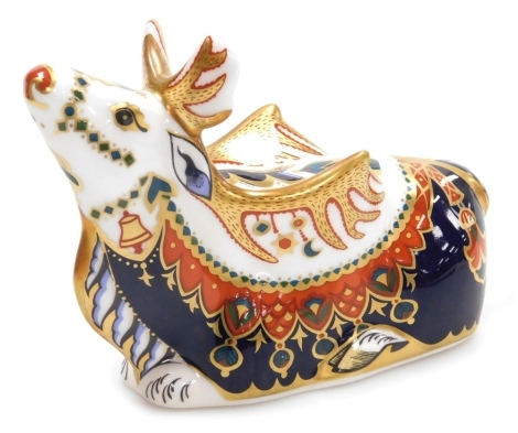 A Royal Crown Derby porcelain Reindeer paperweight, red printed marks and gold stopper, 10cm high, boxed.