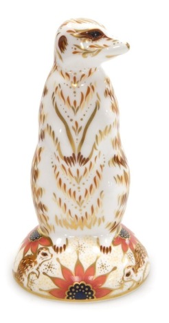 A Royal Crown Derby porcelain Meerkat paperweight, red printed marks and gold stopper, 13.5cm high, boxed.