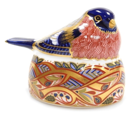 A Royal Crown Derby porcelain Bullfinch Nesting paperweight, red printed marks and silver stopper, 7cm high.