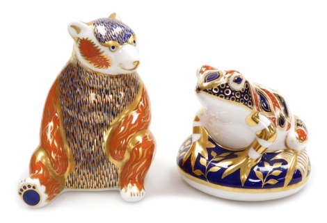 Two Royal Crown Derby porcelain paperweights, comprising Honey Bear, red printed marks and silver stopper, 11.5cm high, and Frog, red printed marks and silver stopper, 8cm high.