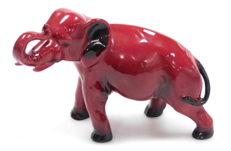 A Royal Doulton Flambe pottery model of an elephant, printed marks, 13.5cm high.