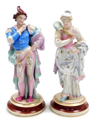 A pair of late 19thC Continental porcelain figures, modelled as a male and female in sixteenth century court dress, gilt heightened, unmarked, 34cm high.