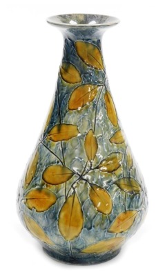 A Royal Doulton stoneware Natural Foliage vase, of cylindrical tapering form, with a flared neck and rim, on a circular base, impressed decorated with leaves against a mottled green and blue ground, model number X6352, impressed marks, 31cm high.