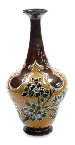 A late 19thC Royal Doulton Lambeth stoneware vase by Rosina Brown, of cylindrical tapering form with an elongated neck, decorated with blue and green flowering branches, with raised bead decorations against a two tone brown ground, model number 706, impre