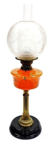 A late 19thC brass and glass oil lamp, with an acid etched floral decorated shade, clear glass chimney, a mottled orange and green glass central reservoir, on a brass Corinthian column, raised on a black glass socle base, 70cm high.