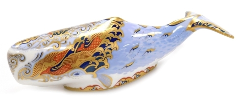 A Royal Crown Derby porcelain Oceanic Whale paperweight, an exclusive for the Royal Crown Derby Collectors Guild, red printed marks and gold stopper, 21.5cm wide.