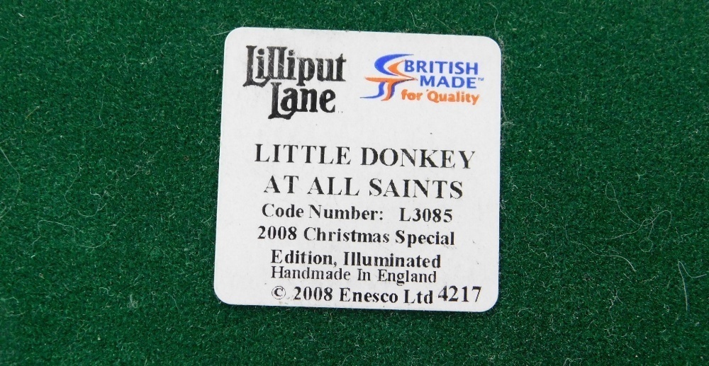 A group of Lilliput Lane, to include Oakwood Smithy, musical All I Want for  Christmas, musical Little Donkey At All Saints, Christmas Sparkle, etc., all  boxed. (some AF)