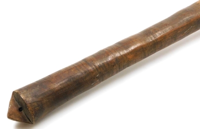 A 19thC Tongan Apa Apai war club, of dense hardwood, the tapering diamond shaped head carved with panels of geometric bands of chevrons, continuing with a plain cylindrical shaft, terminating in a triangular grip with suspension hole, 85cm wide. (AF) - 7