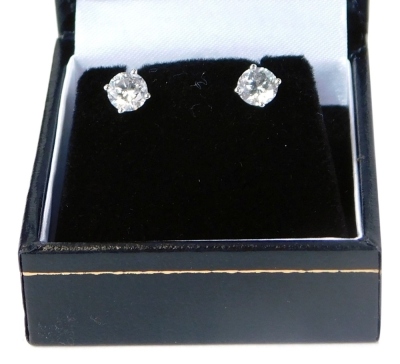 A set of 18ct white gold diamond stud earrings, each with round brilliant cut diamond, in a four claw setting, totalling 1.26ct, on single pin back, with studs, with a World Gemological Institution Certificate, No WGI9624126529, colour G-H, clarity I1, 2.