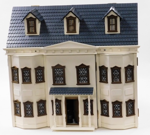 A doll's house, with a central pediment and portico, flanked by double bays, opening to reveal four rooms, with a further room in the roof, with furniture, 71cm high, 78.5cm wide, 44cm deep.