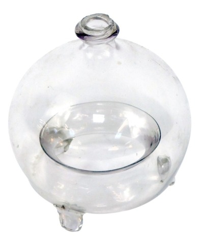 A Victorian blown glass fly catcher or trap, on three feet, 16cm high.