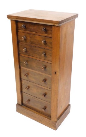 A Victorian mahogany Wellington chest, of seven drawers, raised on a plinth base, 103cm high, 50cm wide, 34cm deep.