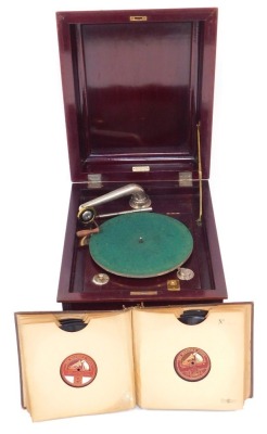 An Edwardian mahogany cased tabletop gramophone, for Leslie Belcher, The Art House Furnisher, New Broadway, Ealing, 38cm high, 47cm wide, 58cm deep, and a small group of records, in album.