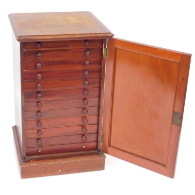 A Victorian mahogany collector's cabinet, the panelled door opening to reveal twelve drawers, each containing specimens of butterflies, moths, beetles, dragonflies and other insects, raised on a plinth base, with key, 87cm high, 52cm wide, 48cm deep. - 2