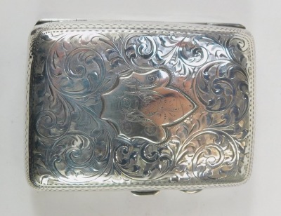 Two items of silverware, comprising an Edward VII silver cigarette case, with heavy foliate scroll decoration and central shield, bearing initials JEH, Birmingham 1908, and a George VI silver ashtray, with engine turned decoration, Birmingham 1937, 3.29oz - 2