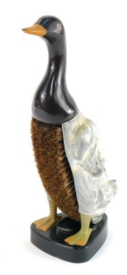 A mid century Bakelite Dandy Duck form clothes brush, 29cm high.