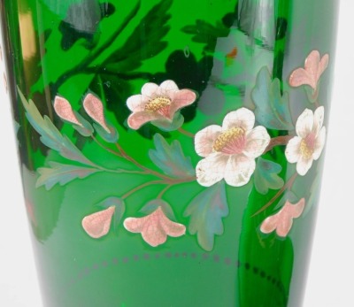 A group of late 19thC green glass, comprising a vase enamel decorated with wild roses, on a knopped stem and stepped circular foot, 32cm high, carafe and stopper, enamel decorated with lily of the valley, 21cm high, cheese dish and cover, enamel decorated - 2