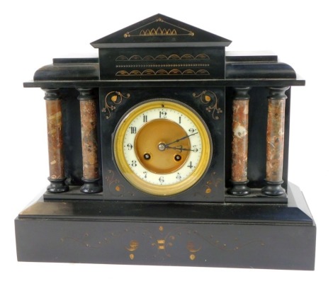 A late 19thC French slate mantel clock, circular brass dial with enamel chapter ring bearing Arabic numerals, Japy Freres and Cie eight day movement with coil strike, the case of architectural form, raised on four marble columns over a plinth base, with p