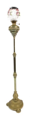 A Victorian brass adjustable standard lamp, with opaque white shade, and beaded dress, on adjustable column, with tripod feet, 178cm high.