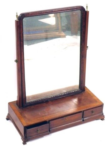 A George III mahogany swing frame dressing table mirror, with rectangular mirror plate, with three drawer support on bracket feet, with boxwood banding, 70cm high, 56cm wide, 27cm deep. (AF)