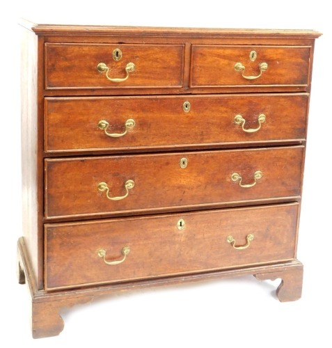 A George III mahogany chest of two short and three long drawers, with brass escutcheons and swing handles, on bracket feet, 103cm high, 101cm wide, 51cm deep.