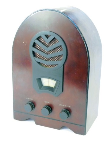 An Art Deco style radio, in red stained lancet shape pine casing, 37cm high.