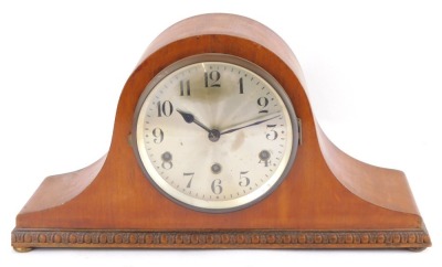 An early 20thC German mahogany cased mantel clock, circular silvered dial bearing Arabic numerals, eight day movement with Westminster chimes, the case of Napoleon hat form, raised on bun feet, 47cm wide.