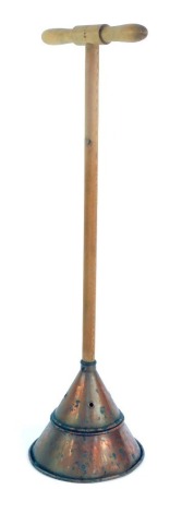 A 20thC copper wash day posher, The Simplex Premiere, with later pine handle, 81cm high.