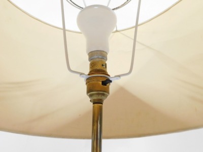 A 1960's teak and brass standard lamp, with an oatmeal coloured shade, raised on a cast iron tripod base, 156cm high. Keyword searches: Svend Aage Holm-Sorensen. - 2