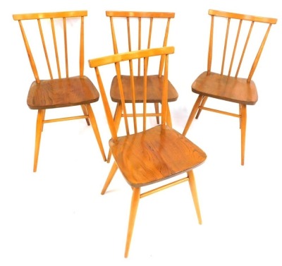 A set of four elm stick back kitchen chairs.